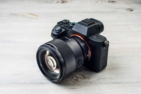 One black camera isolated on white