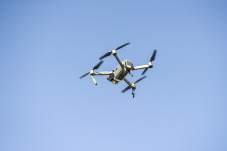 drone flying during the day on a blue sky background