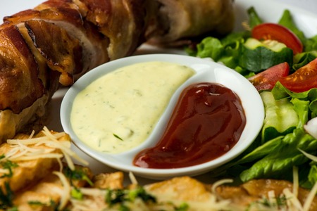 Delicious Chicken rolls with cheese and bacon on a plate close-up. horizontalの写真素材