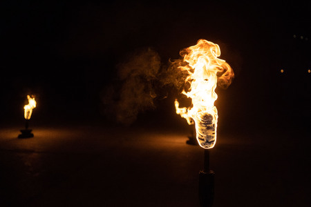 Burning Torch in the Night at black background
