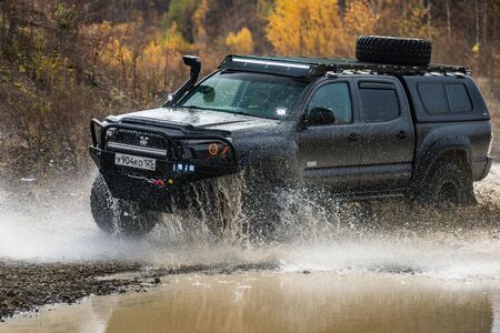 KHABAROVSK, RUSSIA - october 7, 2018: Toyota Tacoma quick ride on a offroad