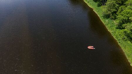 inflatable motor boat. fishing boat on a mountain river. Anyui River. Khabarovsk territory, far East, Russia.の写真素材