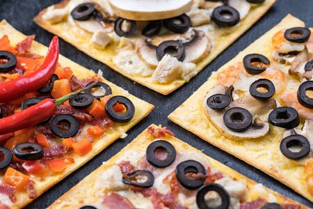 Assorted pizza slices. Margherita, pepperoni, four cheese pizza. Top view. Different types of pizza...