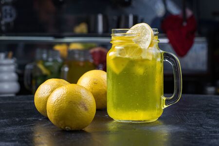 Lemonade or Mojito cocktail with lemon and mint, raspberry, sea buckthorn, grapefruit, cold refreshing drink or drink with iceの写真素材