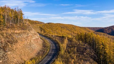 Top view of the taiga forest, river, road . The vast expanses of Eastern Siberia. far East Russia.