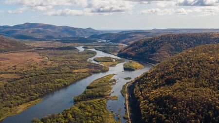 Top view of the taiga forest, river, road . The vast expanses of Eastern Siberia. far East Russia.