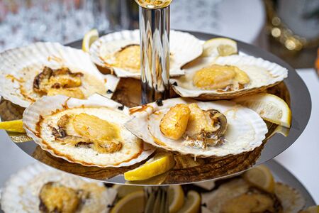 Scallops in the shell, cooked with chili. Delicious