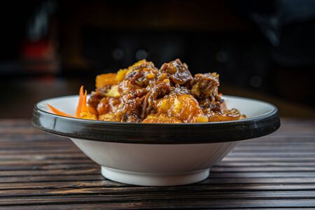 Beef stew with potatoes in a plate.