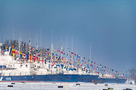 Khabarovsk, Russia February 22, 2020: military border ships decorated for a parade are moored in a...