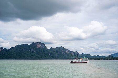 A small boat in a large body of waterundefinedの写真素材