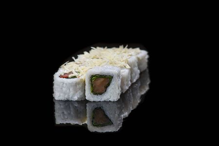 Sushi Roll On A Black Background reflection . Japanese food. Close Up.の写真素材