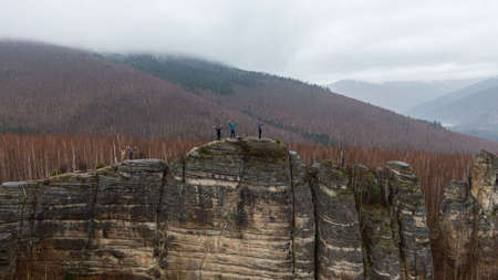 Anyu pillars . Beautiful rocky gray textured background with mosses and lichens. Surface mountain cliff close-up.の写真素材