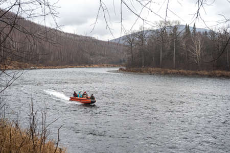 inflatable motor boat. fishing boat on a mountain river. Anyui River. Khabarovsk territory, far East, Russiaの写真素材