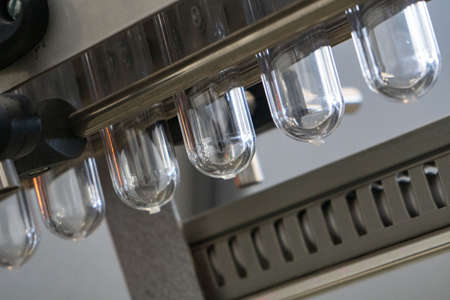 The various type of plastic bottle product and preform material with injection mold background....