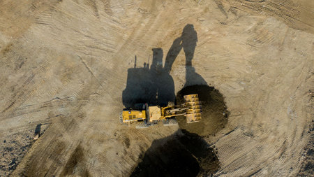 A front end loader machine tipping sand in a quarryの写真素材
