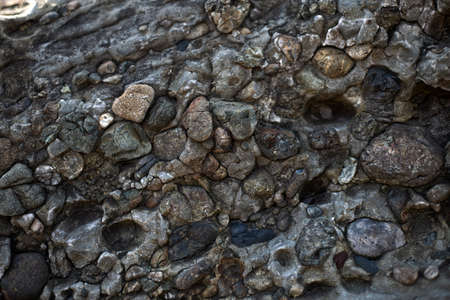 background gray material, old stones, rock near the ocean