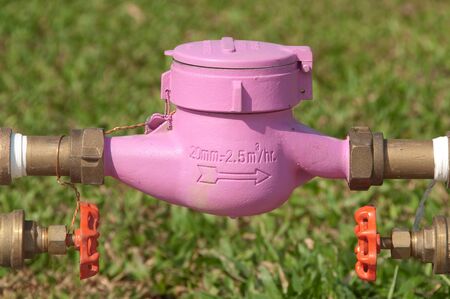 Pink water meters and valves.の写真素材