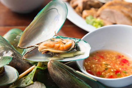 Mussel steam with Thai herb and spicy sauce.の写真素材