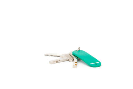Keys and blank tag on isolated background.の写真素材