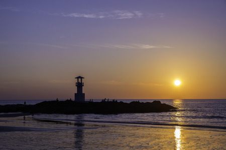 Lighthouse on rock after sunset at Khao Lak, Phang Nga, Thailand.の写真素材