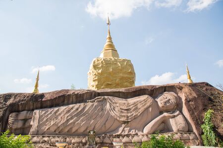 Buddha sleeping carve on rock.の写真素材