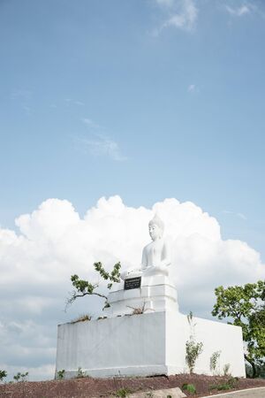 White buddha statue on mountain.の写真素材