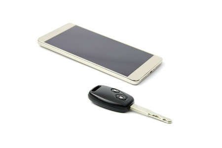 Remote car key and mobile phone on isolated background.の写真素材