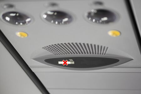 No smoking, light sign on airplane.の写真素材