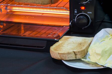 Electric micro oven with bread.の写真素材