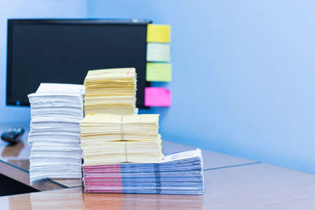 stack of documents on desktop in office.の写真素材