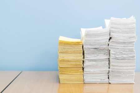 stack of documents on desktop in office.の写真素材