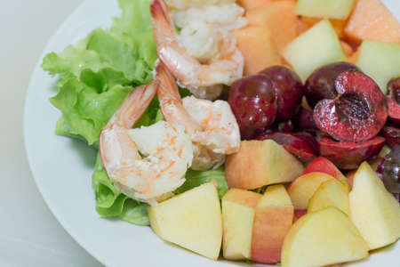 Mix salad vegetable,  fruits and shrimp.の写真素材