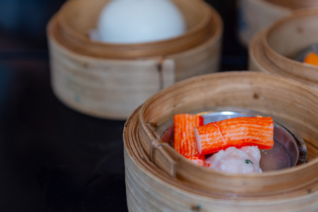 Variety of dim sum steamed in bamboo basket. Chinese breakfast style in southern of Thailand.の写真素材