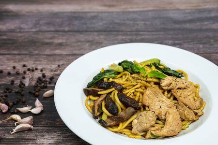 Chinese stir-fried noodles, Shiitake mushrooms, Pork and Cantonese vegetables, Hokkien noodles, Phuket's traditional food.の写真素材