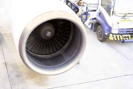 Close up Turbine of engine airplane in airport with light in the morning.
