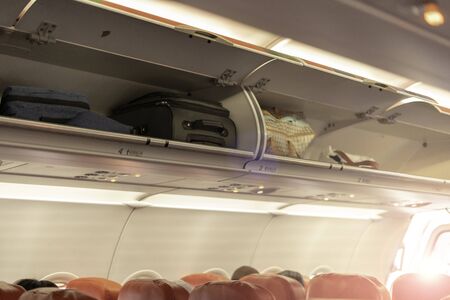 Overhead compartment for put luggage on airplane.の写真素材