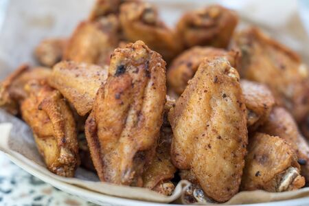 Close-up deep fried chicken wings with salt, Thai food.の写真素材