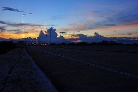 Sunset at Lampang-Chiang Mai highway , Thailandの写真素材