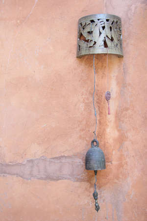 Bell on the old wallの写真素材