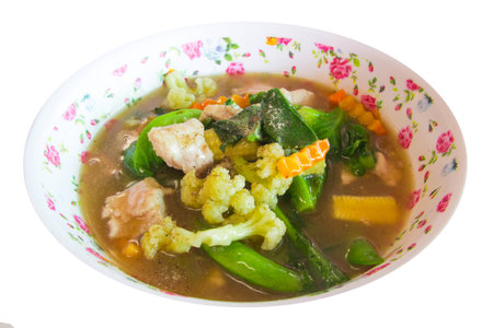 Fried noodle with pork and kale soaked in gravy on white の写真素材