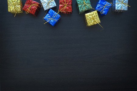 colorful gift box on black wood table