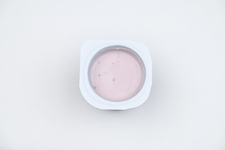 strawberry yogurt isolated on white backgroundの写真素材