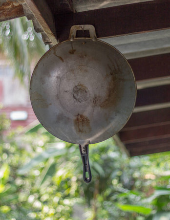 old pan hung on the nail.の写真素材