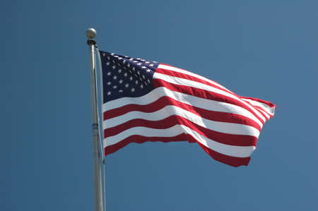 An American flag flaps in the wind.