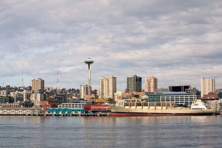 Pier 59 waterfront area of Seattle, including downtown and the Space Needle, taken from the ferry in...
