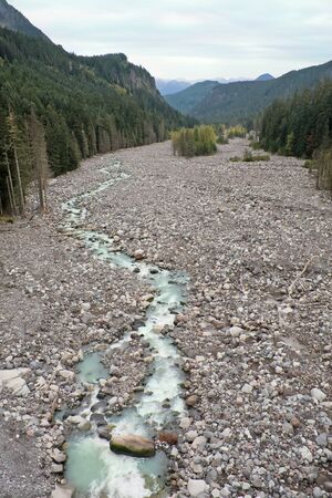 Nisqually River, Glacial Runoff River in Mount Rainier National Park. The riverbed is wide and rocky to accommodate huge spring melts of the glaciers on Mount Rainier.の写真素材