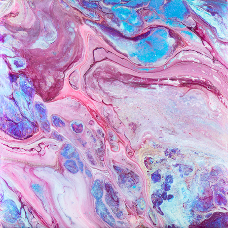 A wild blue and purple acrylic pour painting with gold glitter streaks throughout. Acrylic "dirty pour" flip-cup technique.の写真素材
