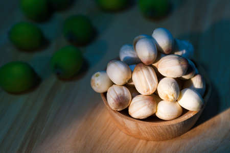 close up lotus seed on small wooden cupの写真素材