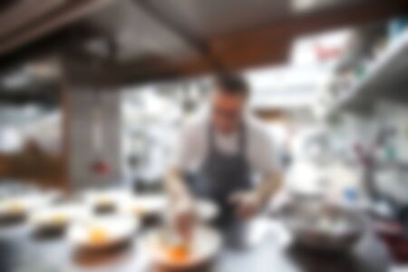 Blurry of Chef in hotel or restaurant kitchen cooking for party