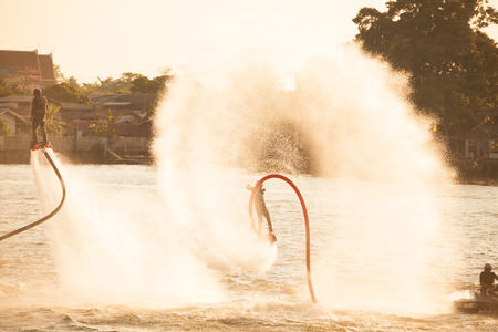 NONTHABURI, THAILAND - February 27 2015:  Showing flyboard on Chaophya river during Chinese new year celebrations on February 27, 2015 Nonthaburi, Thailand.のeditorial素材